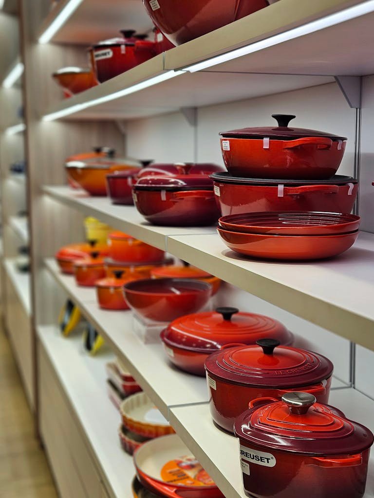 Vibrant array of pots and pans on store shelves in an indoor kitchenware section.

budget Amazon pots and pans